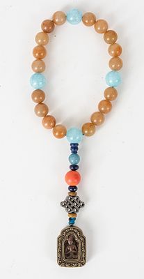BUDDHIST PRAYER BEADS WITH BUDDHA PENDANT. Tibet, 18 brownish jade beads, 4 aquamarine beads, 4 
