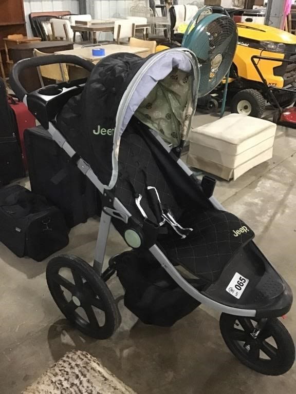 Lot 65: JEEP BABY STROLLER