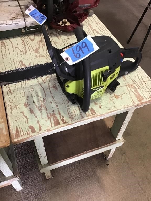 Lot 699: GREEN POULAN CHAIN SAW