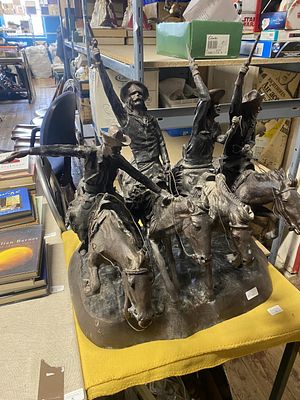 A very large bronze sculpture depicting Cowboys 'Coming through the Rye' by American artist