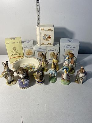 A selection of Royal Albert and Royal Doulton Beatrix Potter and Bunnikins figures etc