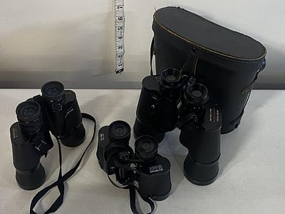Three pairs of assorted field binoculars