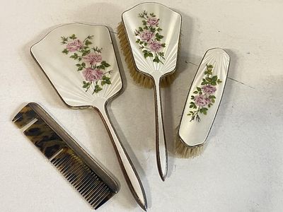 A silver hallmarked dressing table set