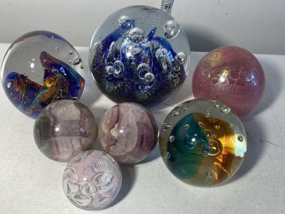 A selection of assorted paperweight and hardstone spheres, shipping unavailable