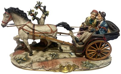 A large Capodimonte Hand-Painted Porcelain Figurine of an Elderly Couple in a Horse-Drawn 