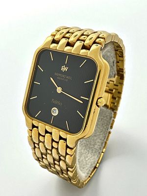 שעון שווייצרי יוניסקס תוצרת ריימונד וייל Raymond Weil מצופה זהב 18k. רצועה ואבזם פטנט מקוריים. 