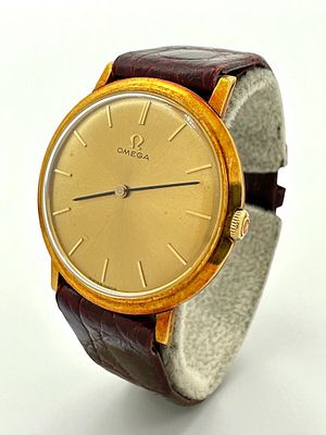 שעון אומגה Omega עשוי זהב 18k לגבר, מנגנון מכני במצב עבודה תקין, כתר מקורי חתום. שנות ה60 
