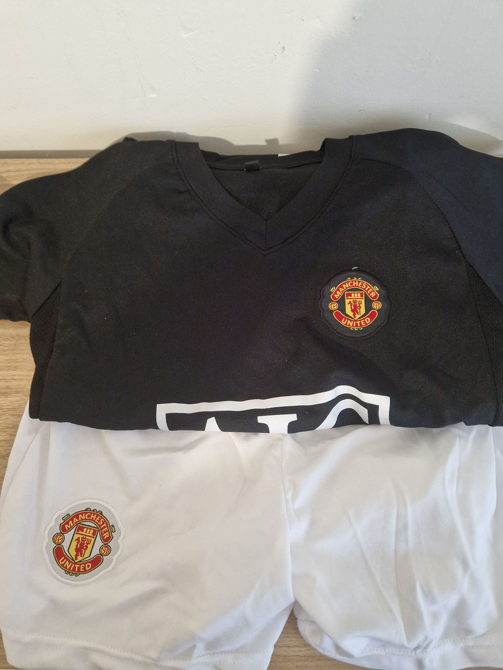 Lot 196: Man united t shirt and shorts