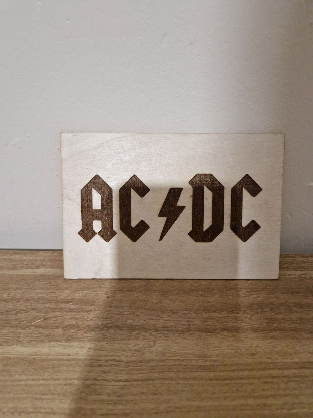 Lot 217: little burnt in AC/DC sign