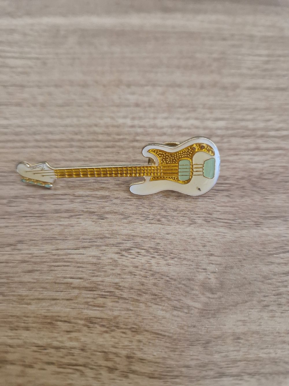 Lot 261: small pin badge