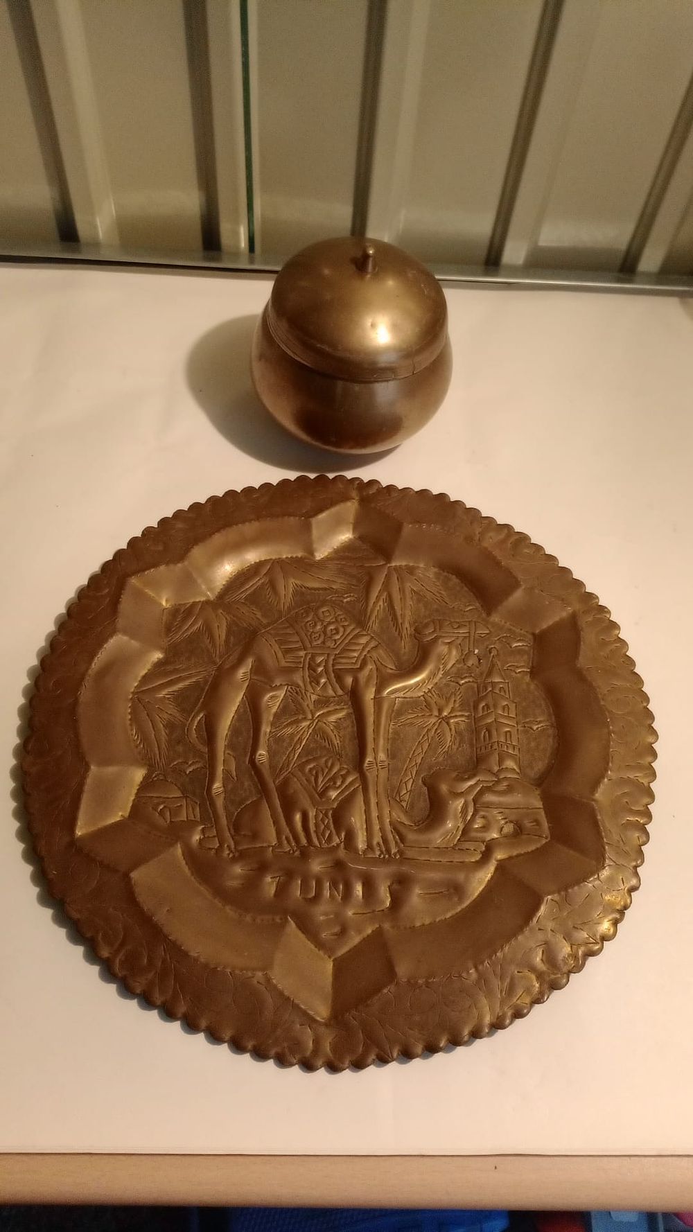 Lot 169: brass plaque and pot
