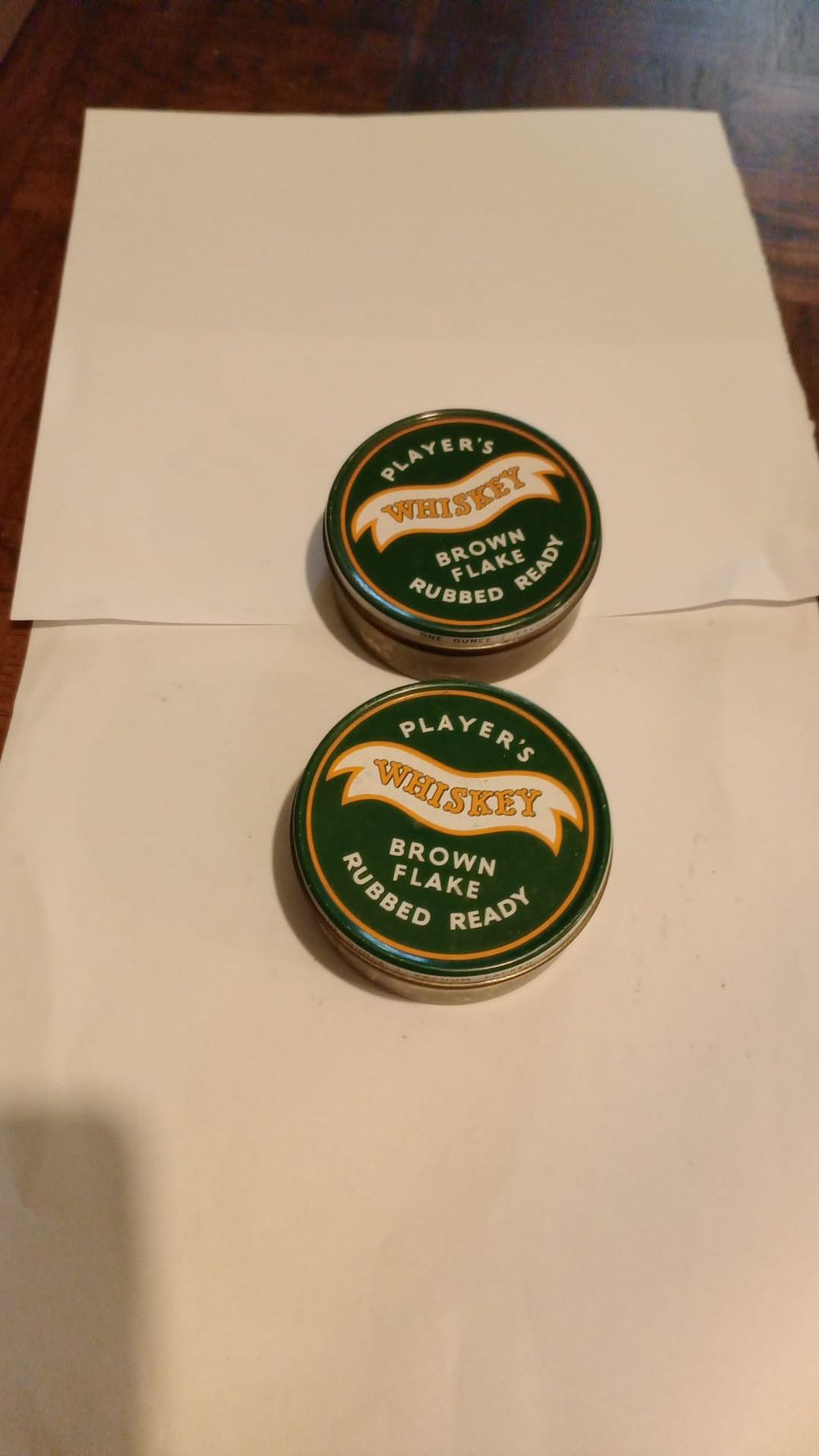 Lot 202: two players tobacco tins