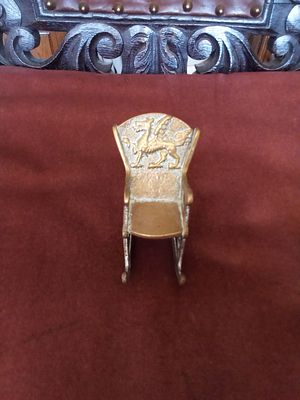 East sussex. Small Vintage brass rocking chair 7 cm H. Welsh dragon emblem on back.E.N.G stamped 