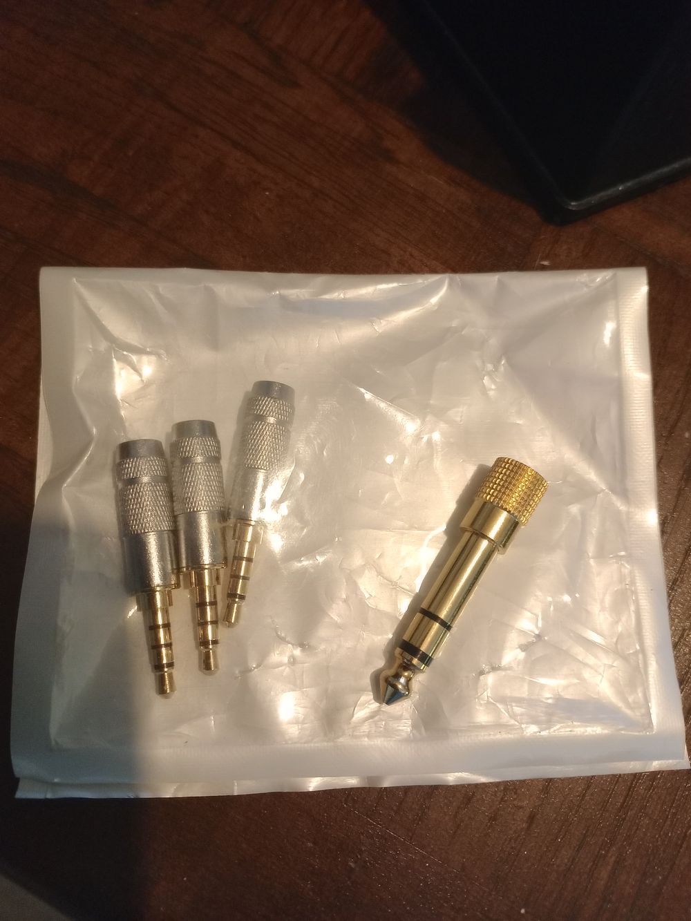 Lot 158:  East sussex. Three new headphones jack plugs and...