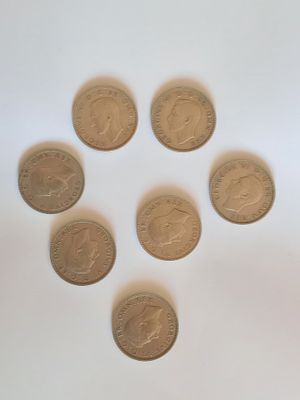 East Sussex. Six 1948 one shillings and one 1947 shilling. All good condition.