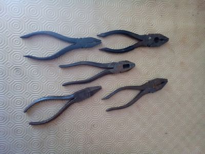 Five pair of vintage pliers working condition.