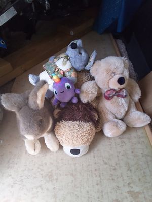 Mixed plush toys.Bag of hair nets and art and crafts items.