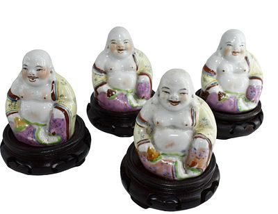 Lotto di quattro sculture diverse raffiguranti buddha, cm 10