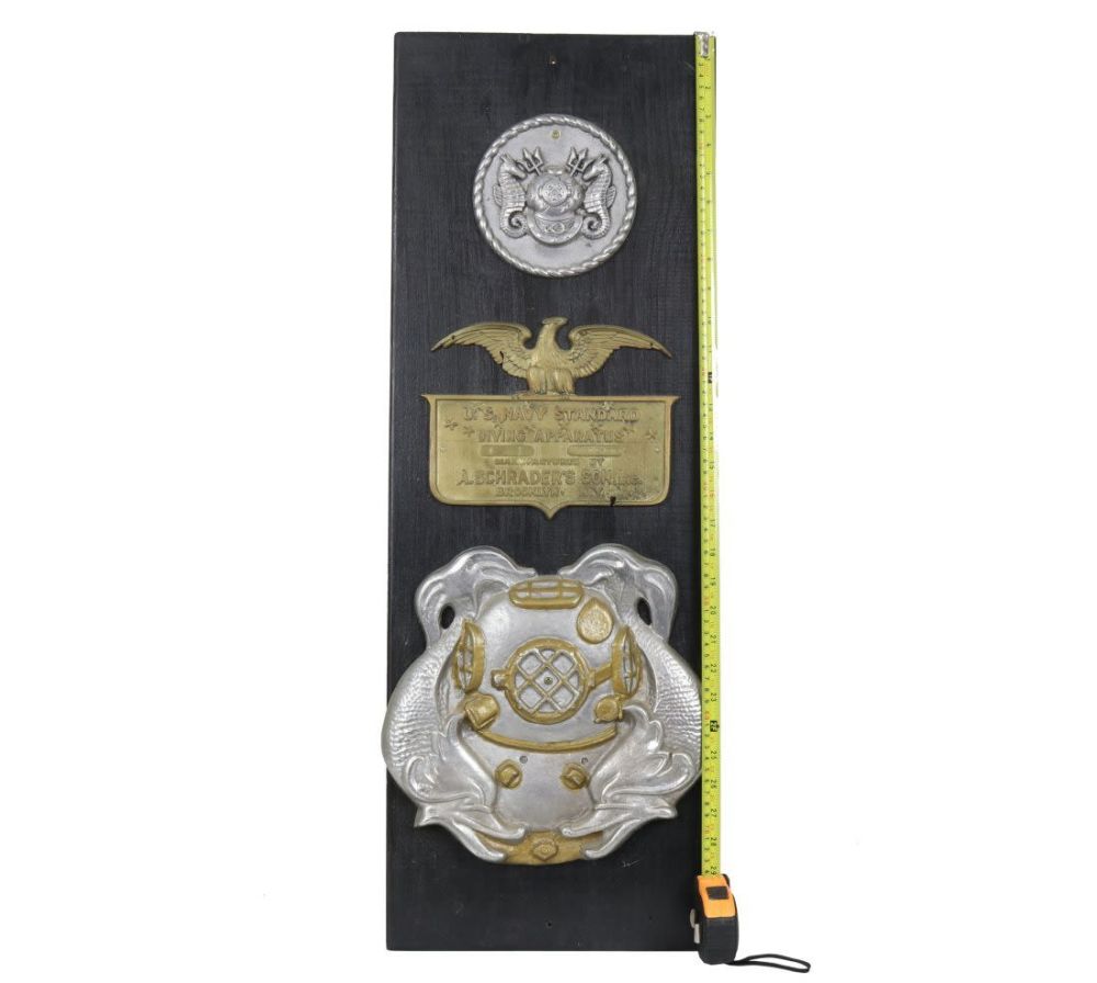 Lot 183: Large Divers Insignia & Pump Metal Plaque Display