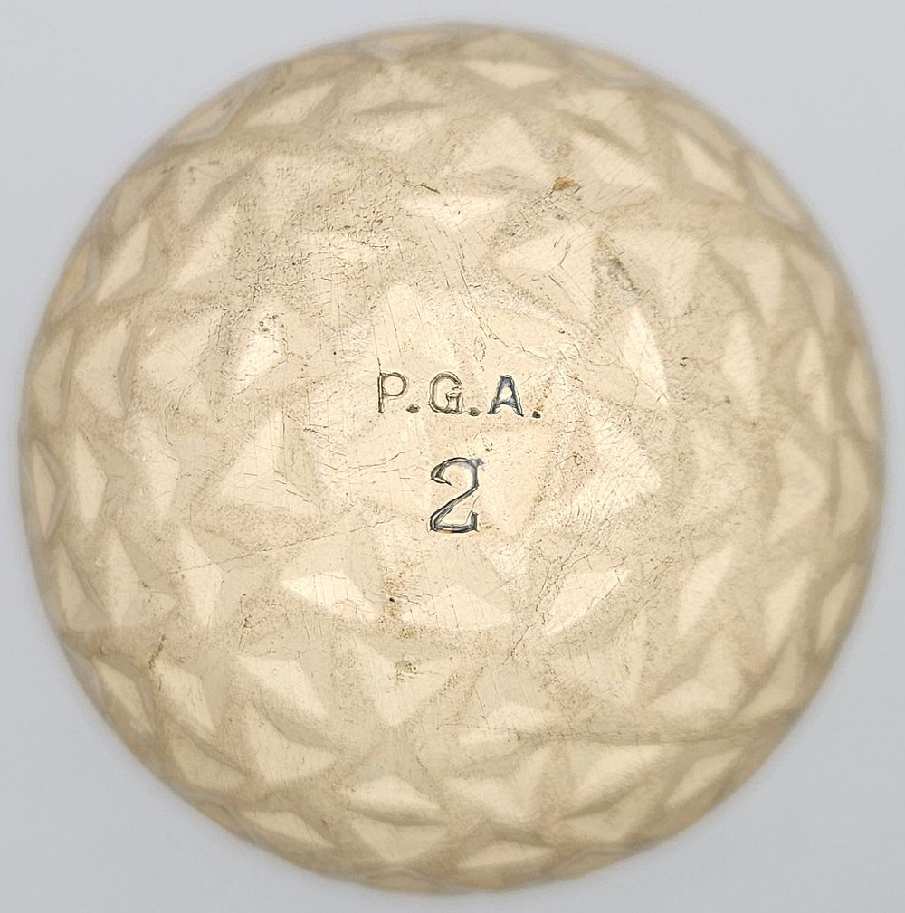 Lot 226: Spalding P.G.A Triangle Pattern Geer Antique Golf Ball 1910’s