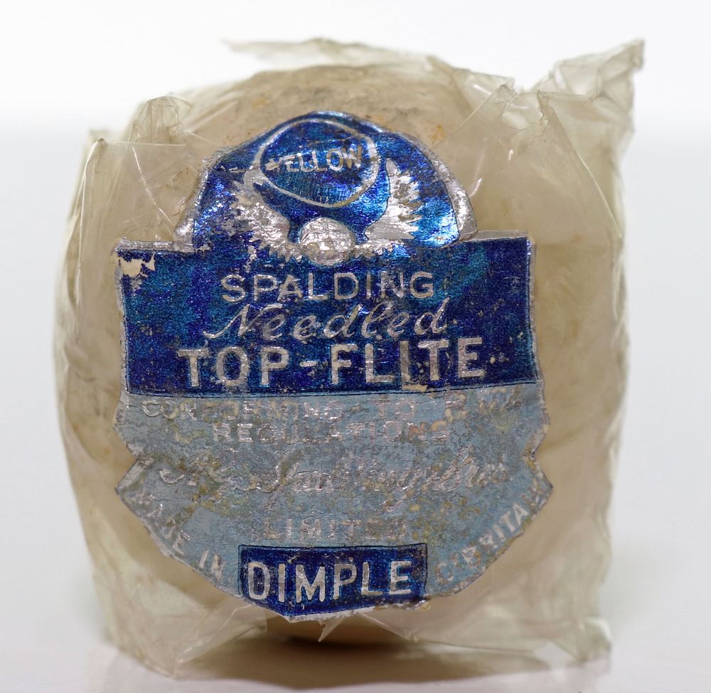 Lot 267: Spalding Needled Top-Flite Yellow In Wrapper Antique Golf Ball