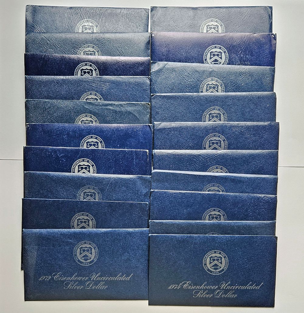 Lot 323: Twenty 1971, 1972, 1973, 1974 Eisenhower 40% Silver Dollar US Mint Sets