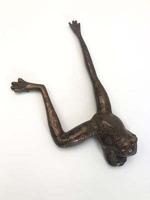 Bronze Frog Sculpture Made In India. Bronze frog sculpture featuring intricate patterns on its 