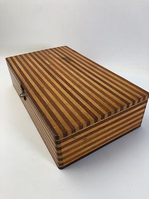 Wood Box With Drafting Tools & Templates. Wooden striped box containing various drafting tools 