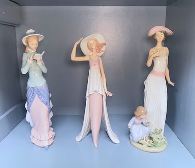 Three tall Lladro porcelain figures of a girl reading, numbered 5000, girl with hat, 5236, and 