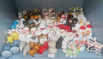 An extensive collection of salt and pepper shakers, including various animals, souvenirs and 