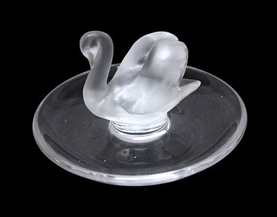A Lalique crystal ring tray or pin dish, modelled with central frost glass swan, 9.5cm diameter.