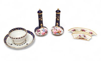 An early 19th century Derby porcelain napkin holder, decorated with grapes and butterflies 
