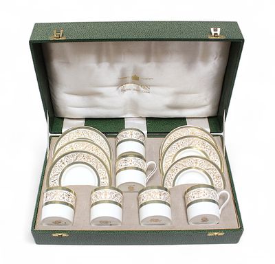 A twelve piece Minton ‘Aragon’ pattern coffee can and saucer set, in fitted and branded box.