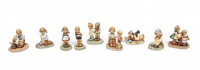 A collection of twenty-seven boxed Studio Hummel, Goebel Hummel and M.J. Hummel figures and 