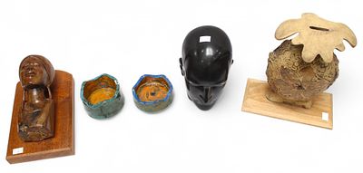 A black glazed pottery model of a life-size male head, 27cm tall, together with an abstract 