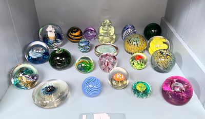 A good collection of 22 assorted glass paperweight including examples by The Island Studio 