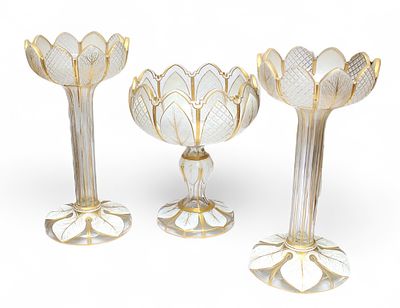 A set of three antique Bohemian white overlay and gilt glass lustre garniture, comprising two 