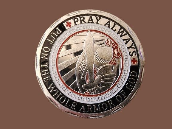 A large coin/medal is stored in a capsule. Diameter 45 mm