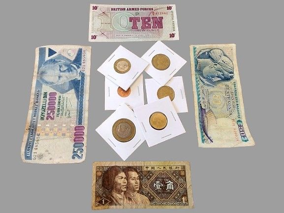 Collection of coins from around the world. Individually packaged for each coin.