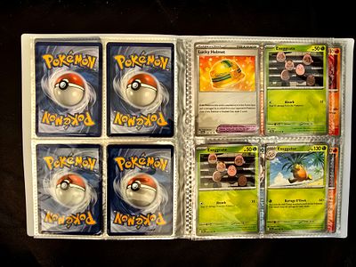 A collection of original Pokemon cards in an album. The album contains a total of 120 original 