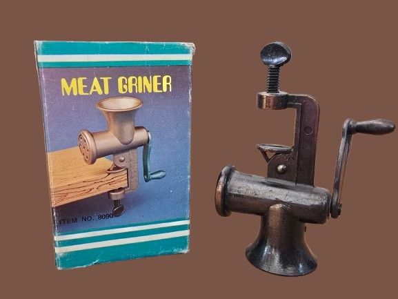 Vintage pencil sharpener made of bronze-tone cast metal - Antique Manual meat grinder in the 