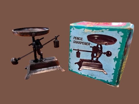 Vintage pencil sharpener made of bronze-tone cast metal - Antique Spring weight in the original 