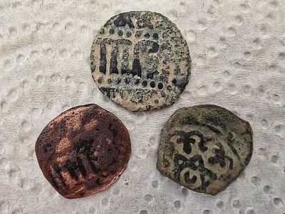 Coins. Unknown authenticity - sold as a replica. 
Items from the group of pottery jars, oil 