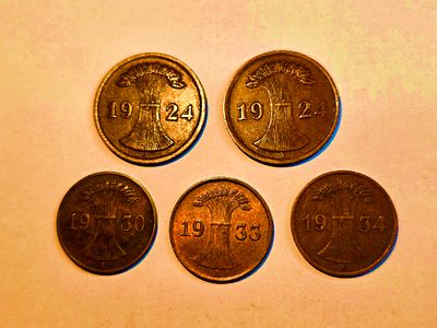 Reichspfennig coins from the Weimar Republic period in Germany. Items from the pottery, oil 