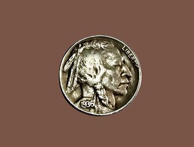 A 1936 Buffalo Nickel, an American collectible coin that was used between 1913 and 1938.