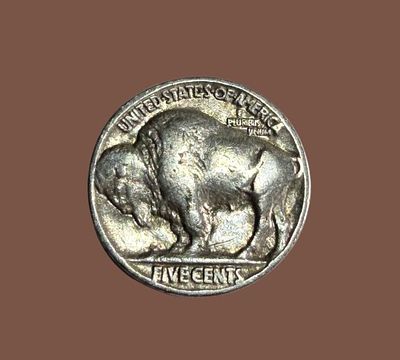 A 1936 Buffalo Nickel, an American collectible coin that was used between 1913 and 1938.