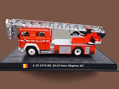 A collectible metal model of a 1975 Iveco Magirus DL 23-12 fire truck, produced in 1:72 scale. A 