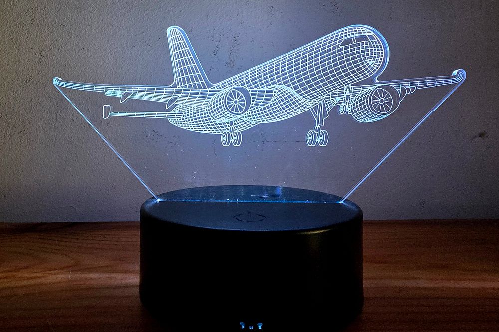 3D Optical Night Light - Boeing Airplane. The lamp creates a 3D illusion by laser engraving on a 
