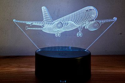 3D Optical Night Light - Boeing Airplane. The lamp creates a 3D illusion by laser engraving on a 