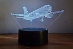 3D Optical Night Light - Boeing Airplane. The lamp creates a 3D illusion by laser engraving on a Image - 1